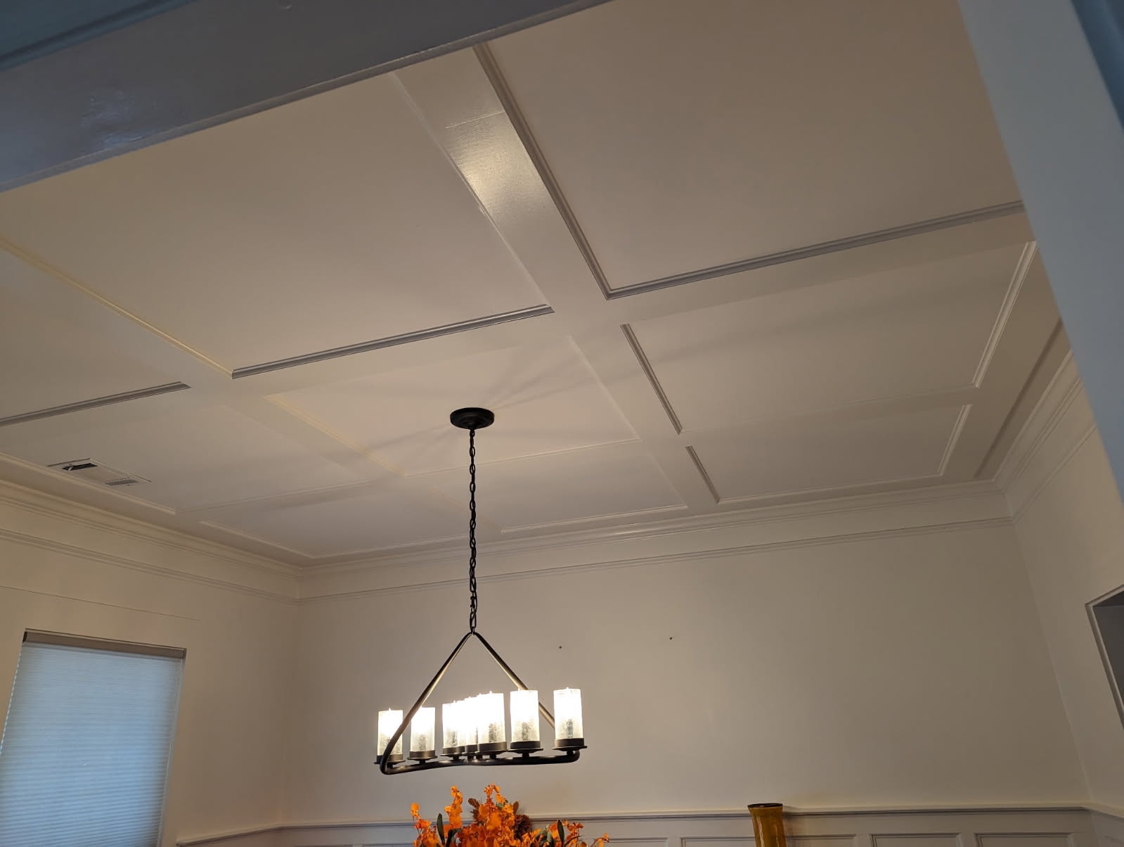 Interior painting – coffered ceiling with crown molding and pendant chandelier